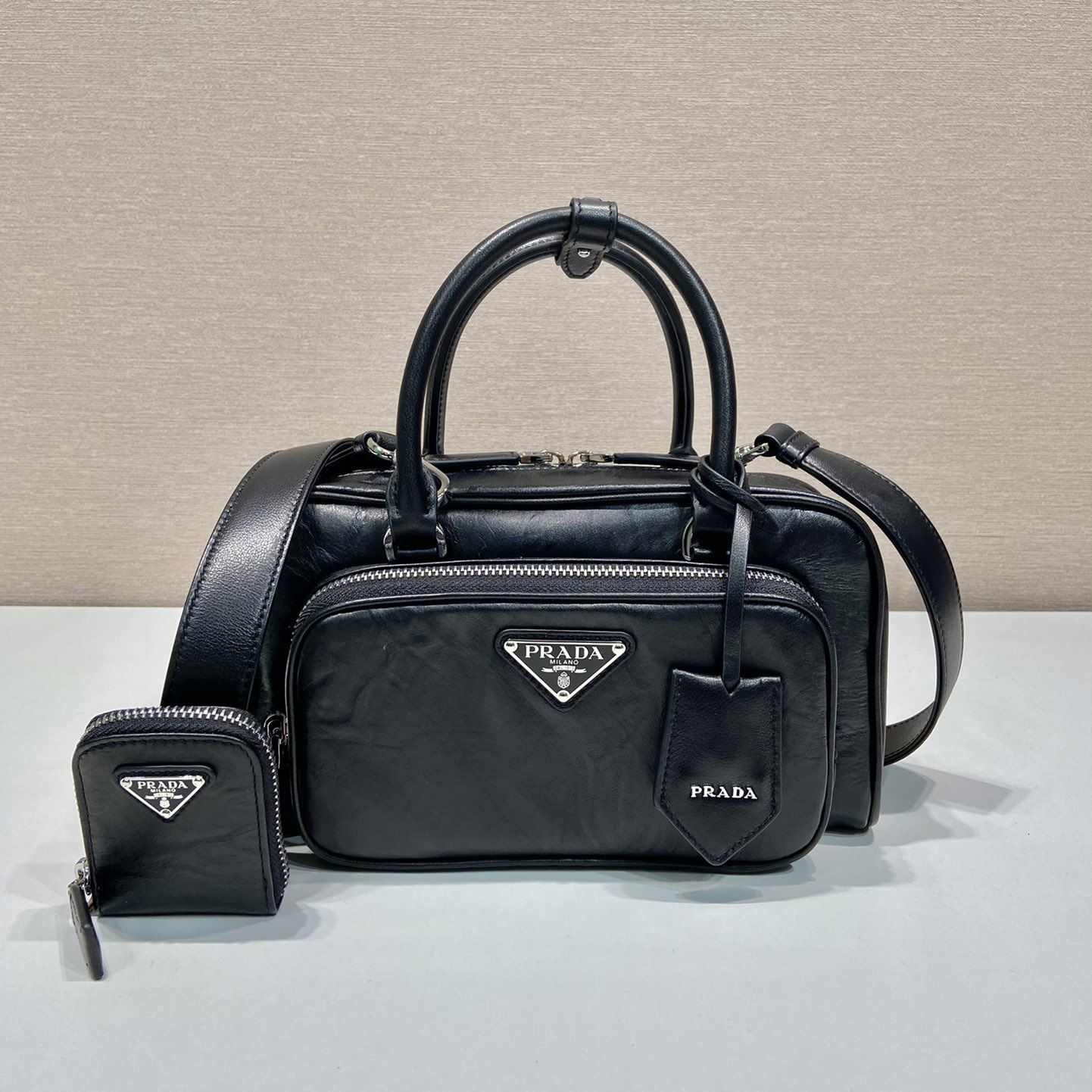 Pra*a top handle bags